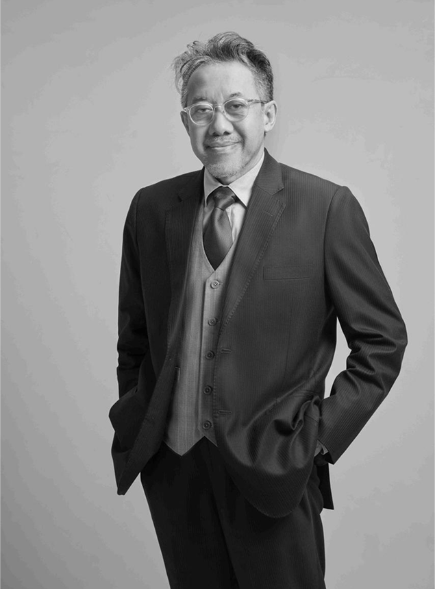 Dr. Khalid in a professional suit